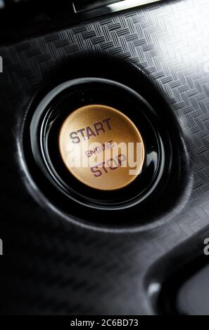Start stop engine button on a modern car dashboard, Car engine start and stop button Stock Photo