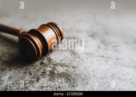 Wooden judge gavel on gray stone background, banner law concept Stock Photo