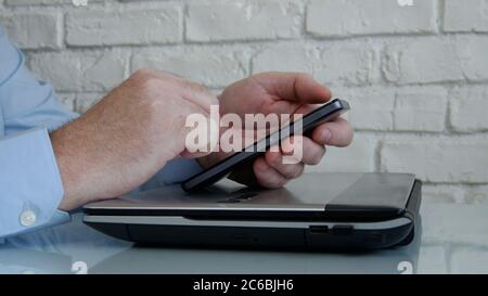 Businessman Working from Home Use Mobile and Internet Connection Accessing from Distance Company Office Network information Stock Photo