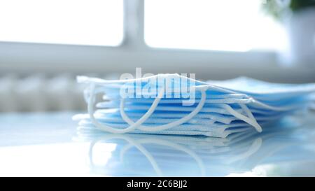 Image with a Pack of Surgical Masks on the Table in a Pharmacy Stock Photo