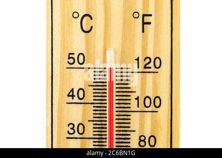 A macro shot of a classic wooden thermometer showing a temperature of 50 degrees Celsius, 122 degrees Fahrenheit, isolated on a white background with Stock Photo