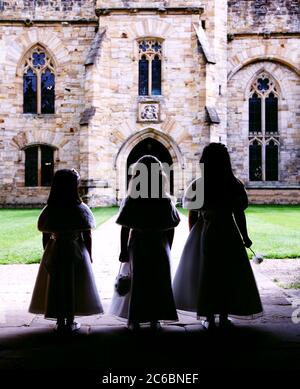 Three 3 bridesmaids 4-5 and 6-7 at Penshurst Place, Kent, England Stock Photo