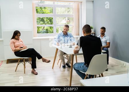 Job Interview Business Meeting At Office With Social Distancing Stock Photo