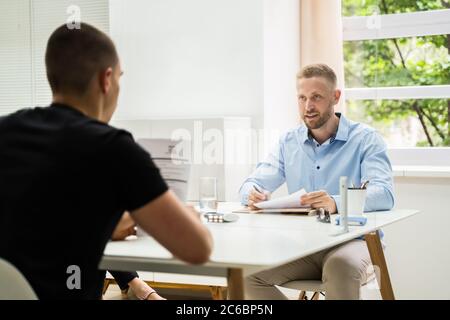 Job Interview Business Meeting At Office With Social Distancing Stock Photo