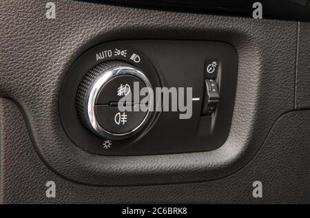 Car lighting switch. Closeup image of car lighting control switch. Stock Photo