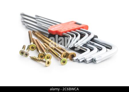 Torx screwdrivers and metal screws isolated on white background. Stock Photo