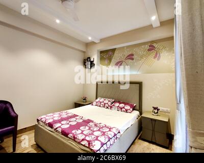 wide angle shot of a modern well designed bedroom with great lighting Stock Photo