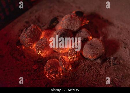 Red hot coals burning in bbq fire place close up Stock Photo