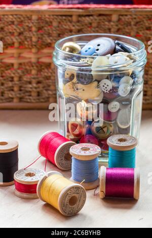 Vintage Buttons and Thread on Wooden Spools Stock Photo