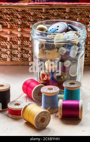 Vintage Buttons and Thread on Wooden Spools Stock Photo