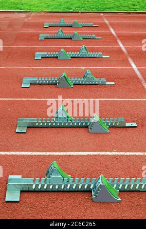 starting blocks for sprinters in an empty athletics stadium in Florence, Italy Stock Photo