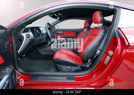 Interior of a sports car. Red leather interior of luxury red sport car. Stock Photo