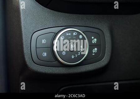 Car lighting switch. Closeup image of car lighting control switch. Stock Photo
