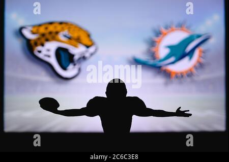 Miami Dolphins vs. Cincinnati Bengals. NFL Game. American Football League  match. Silhouette of professional player celebrate touch down. Screen in  bac Stock Photo - Alamy