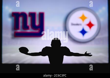 Philadelphia Eagles vs. New York Giants. Fans support on NFL Game.  Silhouette of supporters, big screen with two rivals in background Stock  Photo - Alamy