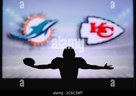 Miami Dolphins vs. Kansas City Chiefs. Fans support on NFL Game. Silhouette  of supporters, big screen with two rivals in background Stock Photo - Alamy