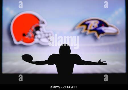 Cleveland Browns vs. Baltimore Ravens. NFL Game. American Football League match. Silhouette of professional player celebrate touch down. Screen in bac Stock Photo