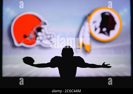 Cleveland Browns vs. Washington Redskins. NFL Game. American Football League match. Silhouette of professional player celebrate touch down. Screen in Stock Photo