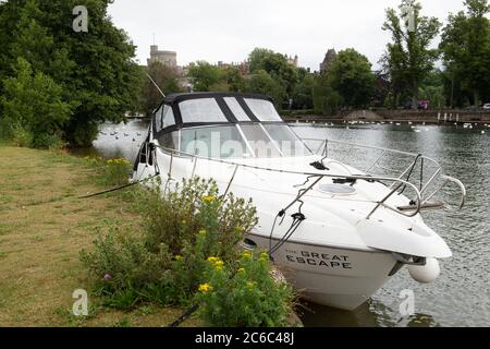 Eton, Windsor, Berkshire, UK. 8th July, 2020. A river cruiser called the Great Escape moors on the River Thames next to the Brocas in Eton during the Coronavirus lockdown. Credit: Maureen McLean/Alamy Stock Photo