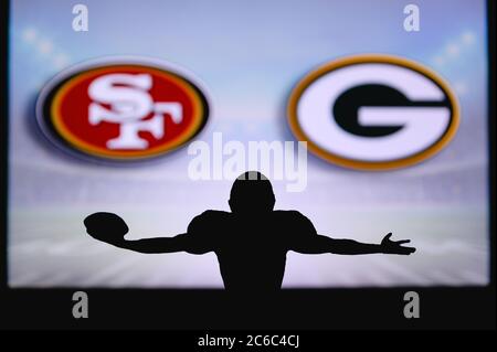San Francisco 49ers vs. Green Bay Packers. NFL Game. American Football League match. Silhouette of professional player celebrate touch down. Screen in Stock Photo