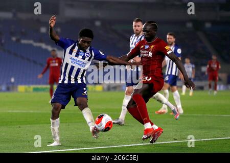 Brighton and Hove Albion's Tariq Lamptey and Liverpool's Sadio Mane (right) during the Premier League match at the AMEX Stadium, Brighton. Stock Photo