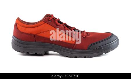 one right cheap orange fabric hiking or hunting shoe isolated on white background - side view Stock Photo