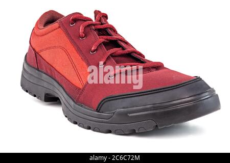 one right cheap red fabric hiking or hunting shoe isolated on white background Stock Photo