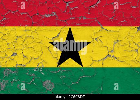 Ghana flag close up grungy, damaged and weathered on wall peeling off paint to see inside surface. Vintage concept. Stock Photo
