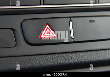 Car hazard lights switch. A switch for the hazard lights in the car. Stock Photo