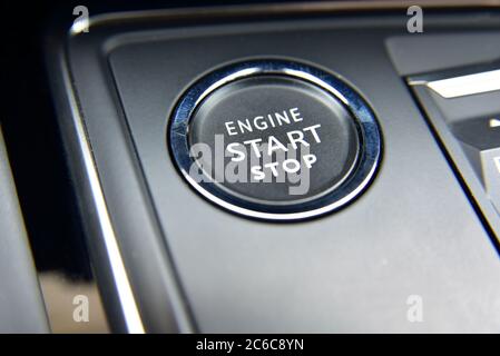 Start engine button. Start stop engine button on a modern car dashboard. Stock Photo