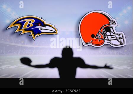 Baltimore Ravens vs. Cleveland Browns. NFL Game. American Football League match. Silhouette of professional player celebrate touch down. Screen in bac Stock Photo