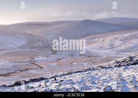 Steeperton Tor in winter from Higher Tor on Belstone Stock Photo