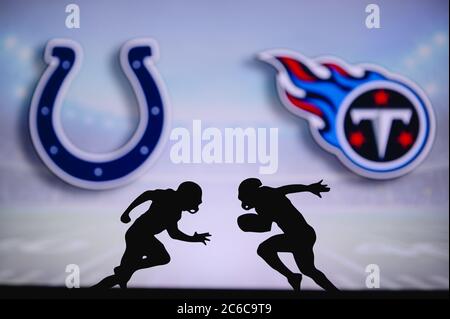 Tennessee Titans vs. Indianapolis Colts. Fans support on NFL Game.  Silhouette of supporters, big screen with two rivals in background. Stock  Photo