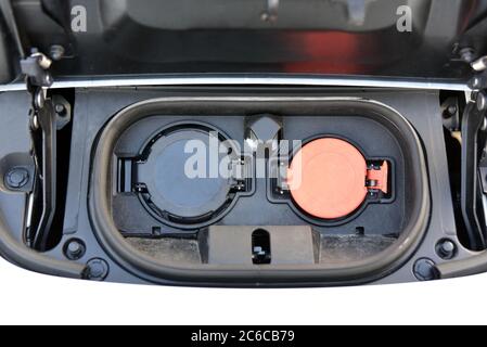 Electric vehicle charging socket by protective cover Stock Photo