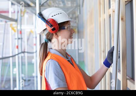 Young woman working in a workshop as artisan manual worker Stock Photo