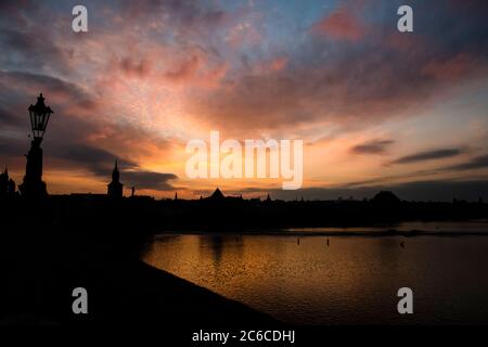Sunrise over Prague and the Vltava river, looking east from The Charles Bridge Stock Photo