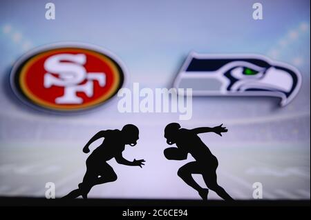 San Francisco 49ers vs. Seattle Seahawks. NFL match poster. Two american football players silhouette facing each other on the field. Clubs logo in bac Stock Photo