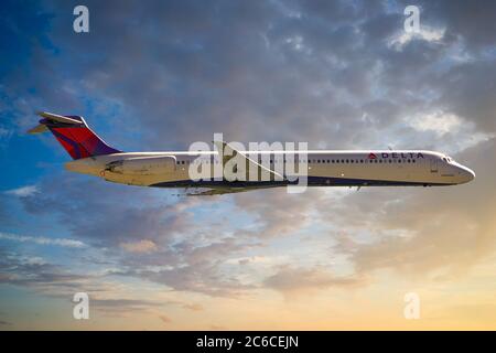 Delta Airlines MD-88 en-route at sunset over America on a scheduled flight Stock Photo
