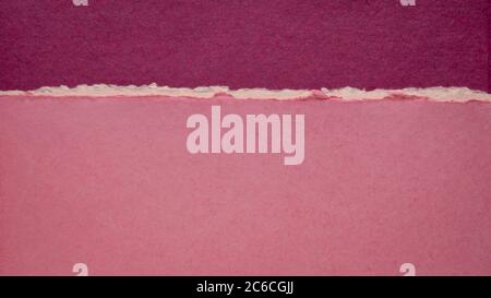 abstract landscape in pink and purple created with handmade Indian rag paper Stock Photo