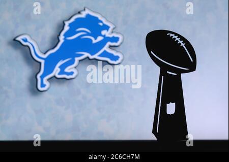 Detroit Lions professional american football club, silhouette of NFL  trophy, logo of the club in background Stock Photo - Alamy