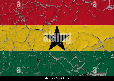 Ghana flag close up grungy, damaged and scratched on wall peeling off paint to see inside surface. Vintage National Concept. Stock Photo