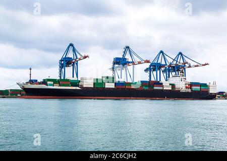 Container ship in a summer day in Genoa in Italy Stock Photo