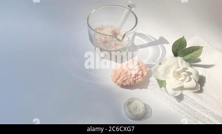 Spa setting and Spa background composition with white gardenia flower on white background. Banner Towel, candles, flowers, stones . Massage, oriental Stock Photo