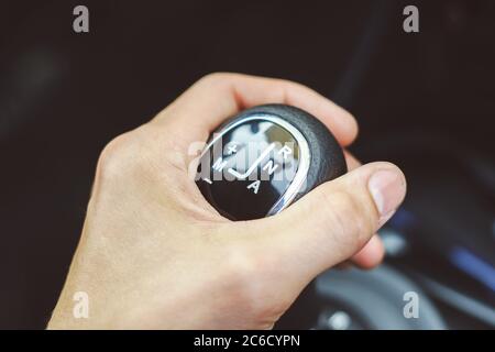 hand on the shift knob in the car close up Stock Photo