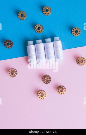 Row Of WhiteThread Spools and Small Bobbins Of Thread Used In A Sewing Machine  Stock Photo