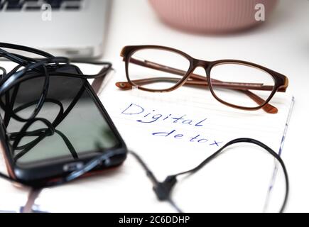 Digital detox concept, words written on notepad Stock Photo