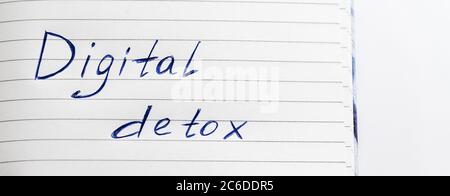 Digital detox concept, words written on notepad Stock Photo