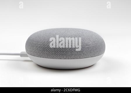 Caserta, Italy - July 9 2018: Google home mini smart speaker, with built in google assistant Stock Photo