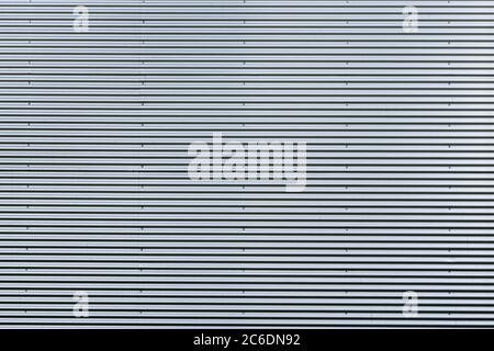 Corrugated metal sheet. New and Modern silver grey background pattern. Stock Photo