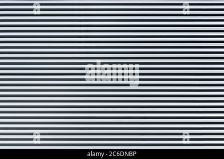 Corrugated metal sheet. New and Modern silver grey background pattern. Stock Photo